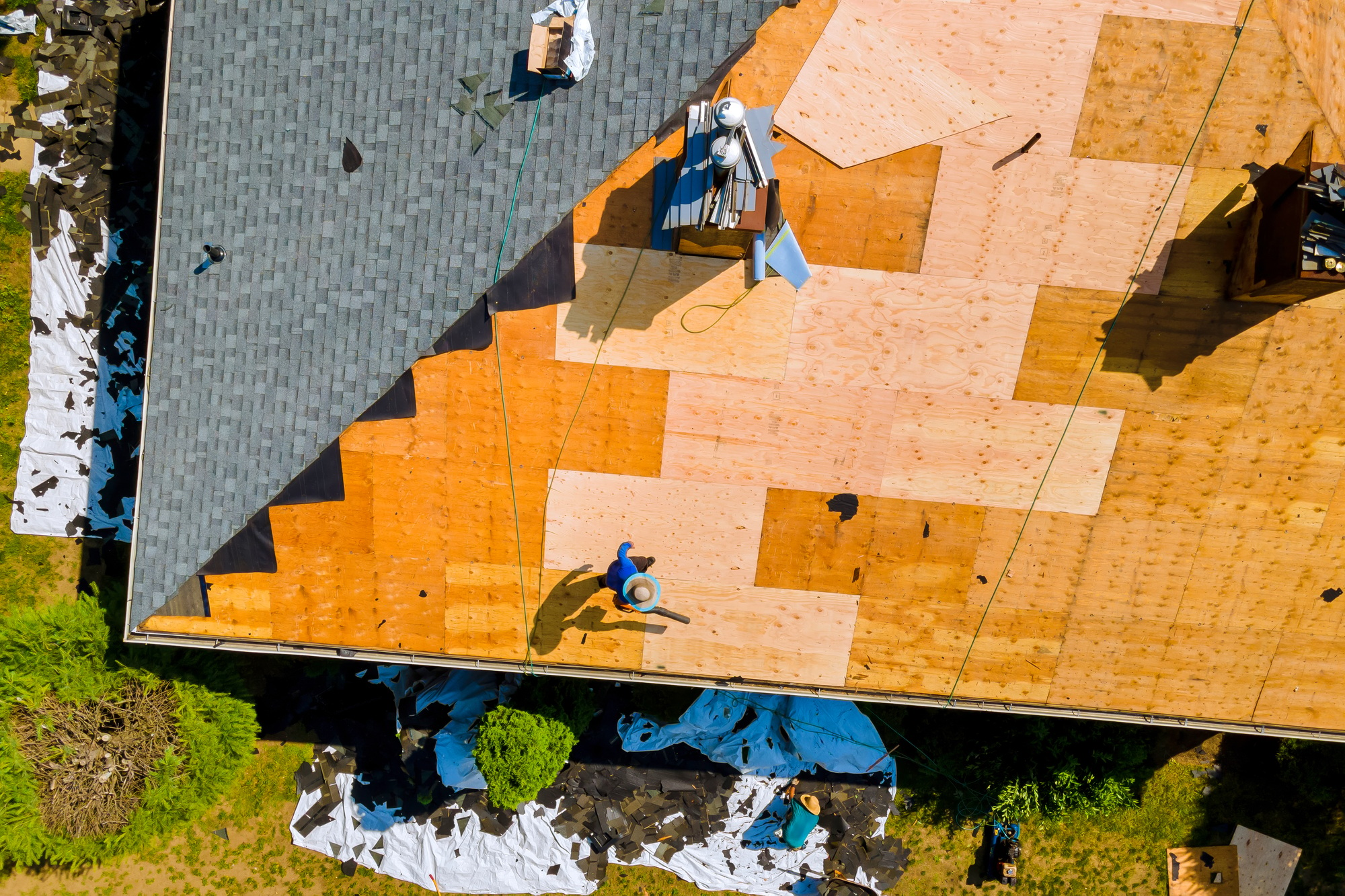 Roof repair by replacing old asphalt bitumen a shingles